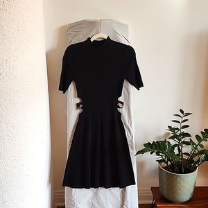 Maje black dress with hollowed out sides with gold chains